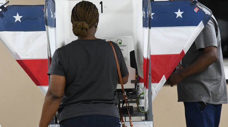 Two voters fill out their ballots in Memphis, Tenn., Wednesday, July 22, 2026. (AP Photo/Kristin M. Hall)