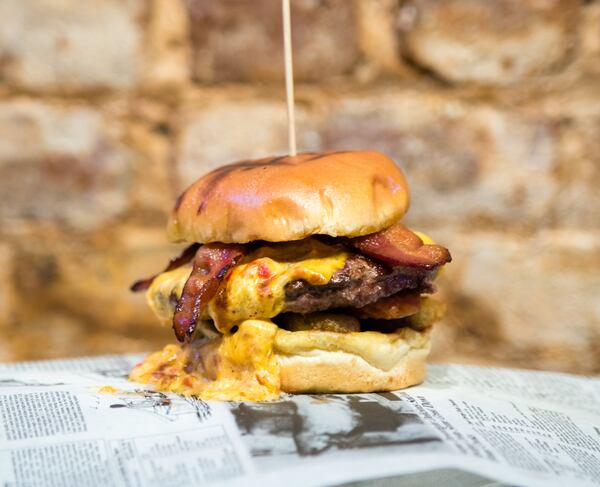  The Hot Mess Burger at Park Bar near Centennial Olympic Park is spicy, messy and a lot of fun, matching characteristics with Best Picture Nominee “Lady BIrd.” CONTRIBUTED BY HENRI HOLLIS