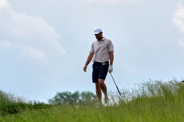 Scottie Scheffler walks down the sixth fairway during a practice round ahead of the U.S. Open golf tournament at Oakmont Country Club Tuesday, June 10, 2025, in Oakmont, Pa. (AP Photo/Seth Wenig)