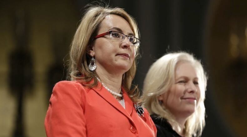 Former Congresswoman Gabby Giffords, left, and Senator Kirsten Gillibrand attend a Women for Hillary event in New York, Monday, April 18, 2016. (AP Photo/Seth Wenig)