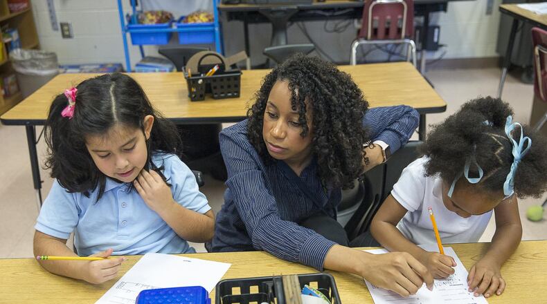 Kindergarten teacher Kelsey McCorkle (center) works with her students during a phonics lesson at Benteen Elementary School in Atlanta on Thursday. Feb. 7, 2019.
