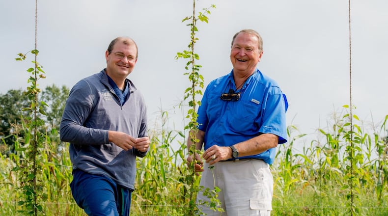 Tripp Morgan (left), founder of Pretoria Fields Collective in Albany, works with his father, farm manager Harris Morgan. CONTRIBUTED BY THE LEVEE STUDIOS