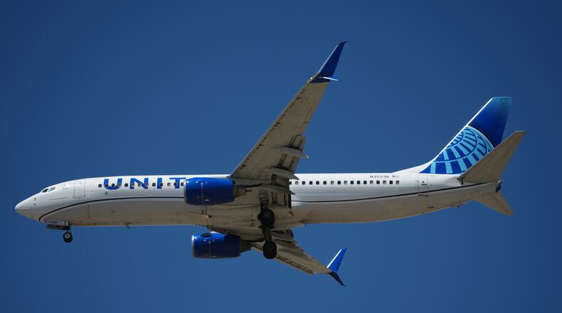 FILE - United Airlines jetliner prepares to land on a runway at Denver International Airport Monday, May 11, 2026, in Denver. (AP Photo/David Zalubowski, File)