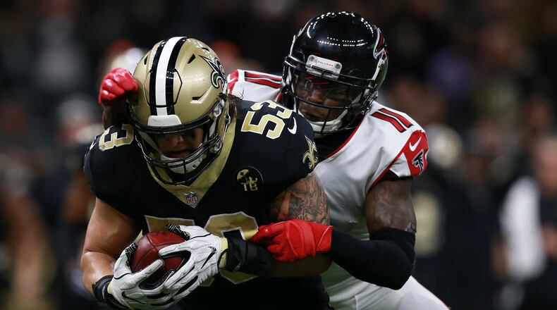 NEW ORLEANS, LOUISIANA - NOVEMBER 22: A.J. Klein #53 of the New Orleans Saints returns an interception as Julio Jones #11 of the Atlanta Falcons defends during the second half at the Mercedes-Benz Superdome on November 22, 2018 in New Orleans, Louisiana. (Photo by Sean Gardner/Getty Images)