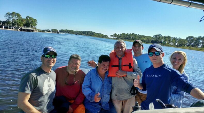 Brandon Phillips, in the Seaside shirt, with several of the men stranded in the water. Special/Brandon Phillips.
