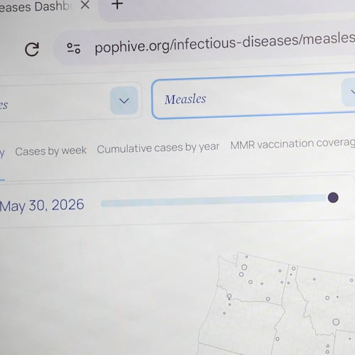 Georgetown University's Rebecca Katz points to measles data for the country at Georgetown's Health Security Operations Center in Washington on June 3, 2026. (AP Photo/Shelby Lum)