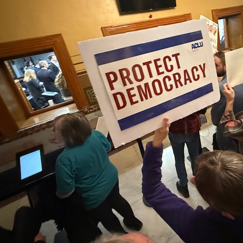 Protesters gather outside the Senate chamber at the Statehouse as senators meet during a special session to vote on a new congressional map Monday, Dec. 8, 2025, in Indianapolis. (AP Photo/Obed Lamy)
