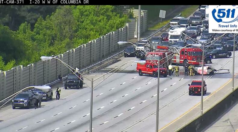 The eastbound lanes of I-20 were shut down for about two hours Thursday morning following a fatal wreck and car fire in DeKalb County.