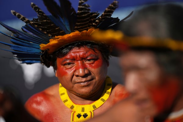 An Indigenous man protests against the auction of dozens of oil blocks, including blocks near the mouth of the Amazon River, in Rio de Janeiro, Tuesday, June 17, 2025. (AP Photo/Silvia Izquierdo
