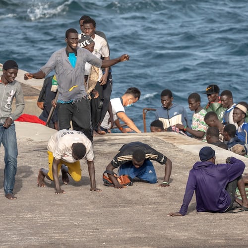 FILE - Migrants react as they arrive at the port in La Restinga on the Canary island of El Hierro, Spain, on, Aug. 19, 2024. (AP Photo/Maria Ximena, File)