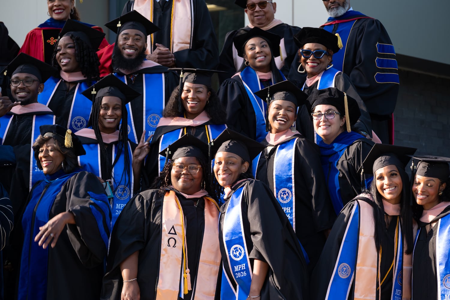 Masters of public health students pose for a photo before graduation at Morehouse School of Medicine on Saturday, May 16, 2026, in Atlanta. (Ben Gray for the AJC)