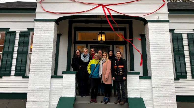 Samantha Bee in front of the new house her show purchased for El Refugio, a Decatur-based charity that provides free lodging and food for families visiting undocumented immigrants detained at Stewart Detention Center in Lumpkin. CREDIT: El Refugio