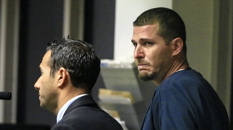 Matthew Notebaert, right, looks back at family members in the courtroom as he stands with his attorney Steven Bell Thursday morning, May 8, 2014 facing charges of vehicular homicide and of driving under the influence of alcohol. (Lannis Waters / The Palm Beach Post)
