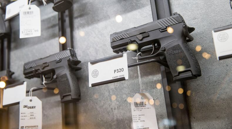 The political divide on guns in Georgia was on display Tuesday as voters prepared to vote in the state’s primary. Democrats backed candidates who took strong positions on tightening gun laws, while Republican candidates supported expanding gun rights. ALYSSA POINTER/ALYSSA.POINTER@AJC.COM