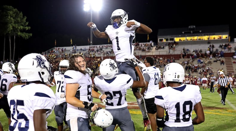 September 6, 2019 - Snellville, Ga: South Gwinnett quarterback Tre Truitt (1) celebrates with Caleb Pedro (27) after they defeated Brookwood 35-21 at Brookwood High School Friday, September 6, 2019 in Snellville, Ga.. (JASON GETZ/SPECIAL TO THE AJC)
