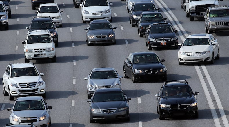 There are blinkers on cars for a reason. Drivers jockey for position on the Downtown Connector on Tuesday August 12, 2014. BEN GRAY / BGRAY@AJC.COM