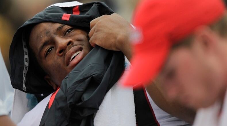 FILE - In this Oct. 10, 2015, file photo, Georgia running back Nick Chubb lies on a table after being injured on a tackle during the first half of the team's NCAA college football game against Tennessee in Knoxville, Tenn. Chubb blew out his left knee in the sixth game of last season, depriving the Bulldogs of one of the best running backs in the country. New coach Kirby Smart has been cautious about making predictions about Chubb's return and you can all but guarantee the running back will spend more time riding a stationary bike at spring practice than carrying a ball. (AP Photo/Wade Payne, File)