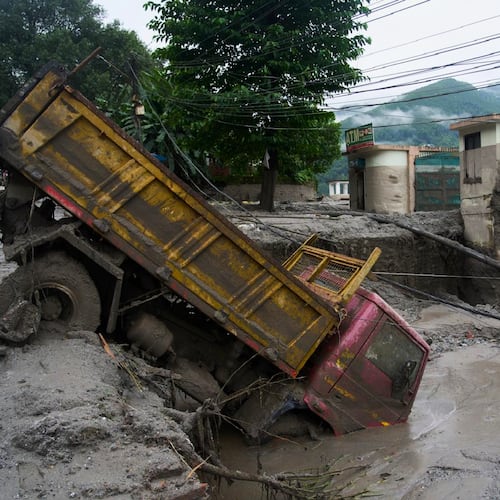 A vehicle is seen in the aftermath of a flash floods in Devighat in the Nuwakot district in Nepal. Thursday, Aug 27, 2026. (AP Photo/Niranjan Shrestha)