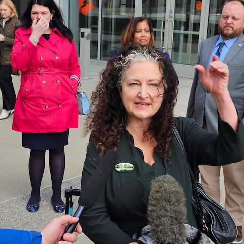 Attorney Amanda Cialkowski speaks with reporters outside the federal courthouse in St. Paul, Minn., Wednesday, April 8, 2026, after a hearing on a lawsuit by the Fridley and Duluth school districts and the Education Minnesota teachers union that seeks to block a Trump administration change in policy that gave immigration authorities a freer hand to conduct enforcement actions in and near schools. (AP Photo/Steve Karnowski)