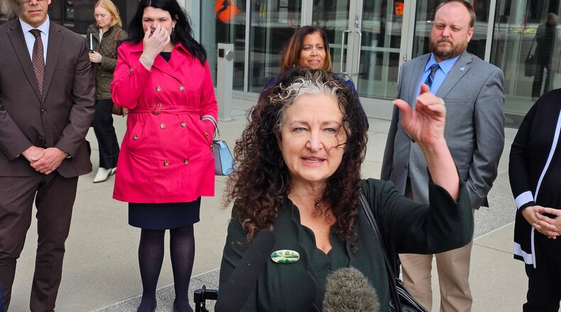 Attorney Amanda Cialkowski speaks with reporters outside the federal courthouse in St. Paul, Minn., Wednesday, April 8, 2026, after a hearing on a lawsuit by the Fridley and Duluth school districts and the Education Minnesota teachers union that seeks to block a Trump administration change in policy that gave immigration authorities a freer hand to conduct enforcement actions in and near schools. (AP Photo/Steve Karnowski)