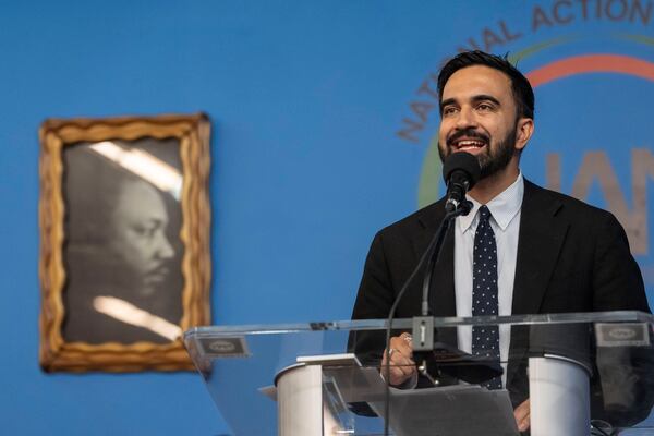 Democratic mayoral candidate Zohran Mamdani speaks next to a portrait of Martin Luther King Jr. during the National Action Network's Saturday action rally at House of Justice in Harlem, Saturday, June 28, 2025, in New York. (AP Photo/Yuki Iwamura)