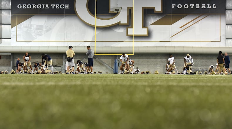 August 4, 2017 Atlanta - Georgia Tech players warm up during the first day of Georgia Tech football practice at Rose Bowl Field in Georgia Tech campus on Friday, August 4, 2017. HYOSUB SHIN / HSHIN@AJC.COM