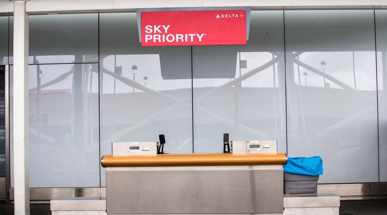 Hartsfield Jackson International Airport is basically empty midday Wednesday, April 8, 2020. Curbside check in is closed, parking lots have few cars and flights are minimal. (Jenni Girtman for Atlanta Journal-Constitution)