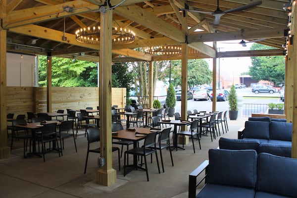 A patio bar that opens to a parking lot.