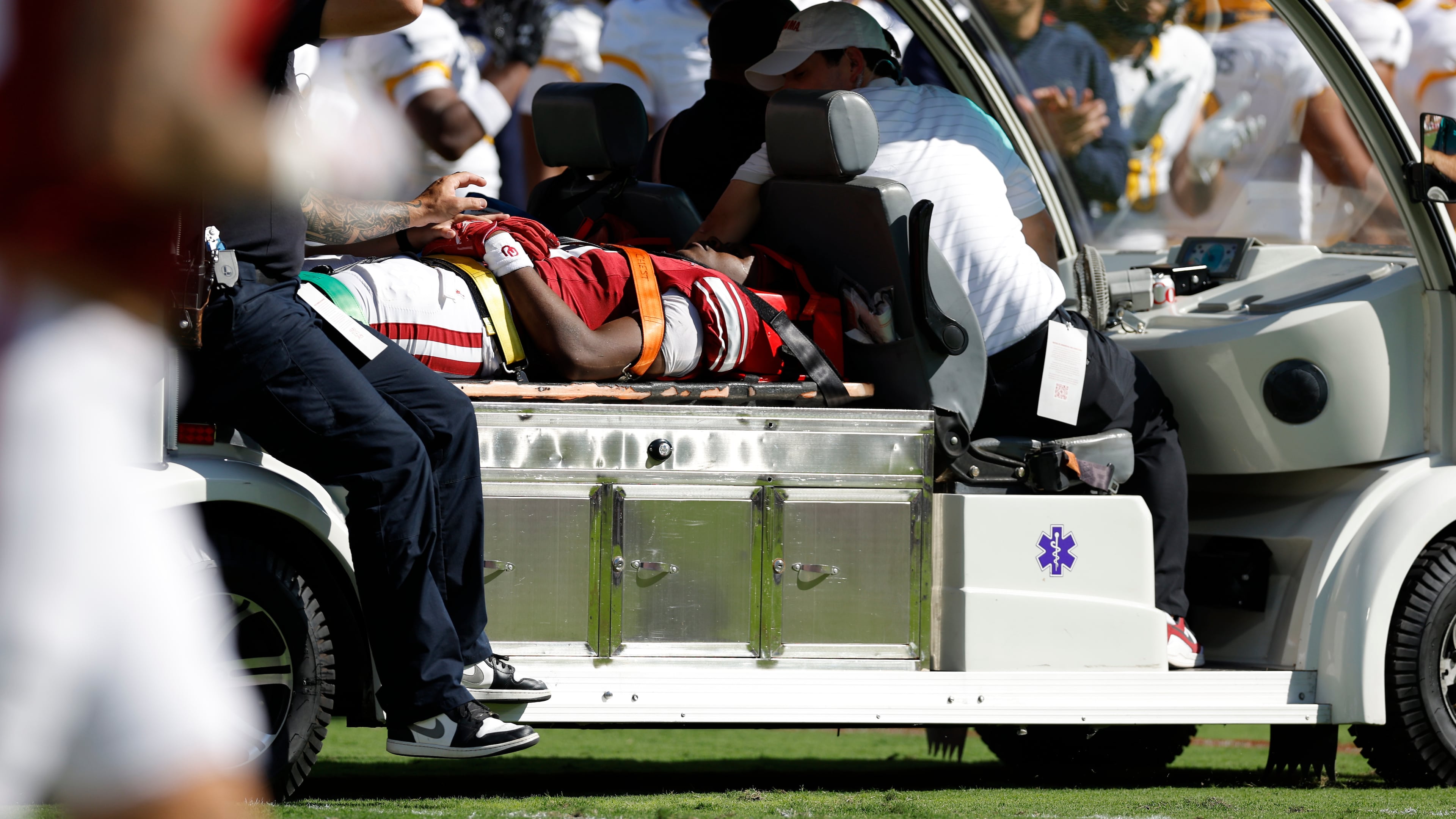 Oklahoma wide receiver Keontez Lewis, center, is carted off the field after a play against Kent State during the first half of an NCAA college football game Saturday, Oct. 4, 2025, in Norman, Okla. (AP Photo/Alonzo Adams)
