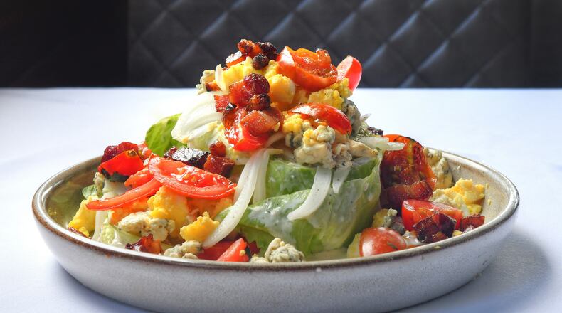 210626 Brookhaven, Ga.: Iceberg Wedge Salad, from Arnette's Chop Shop. Photo for story on wedge salads for Food cover story. Photo taken Wednesday June 26, 2021 at Arnette's Chop Shop, 2700 Apple Valley Road, Brookhaven, Ga. Styling by chef Stephen Herman. (Chris Hunt for The Atlanta Journal-Constitution)