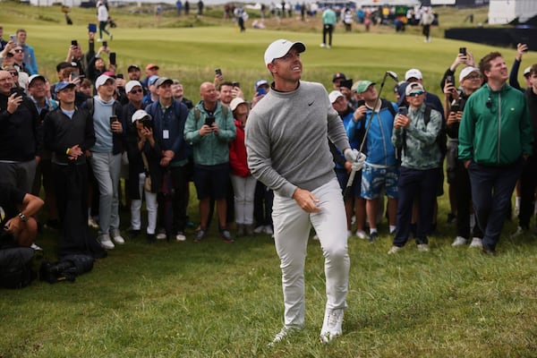 Rory McIlroy of Northern Ireland watches the fight of the ball after he chiped out of the rough on the 2nd hole during the first round of the British Open golf championship at the Royal Portrush Golf Club, Northern Ireland, Thursday, July 17, 2025. (AP Photo/Peter Morrison)