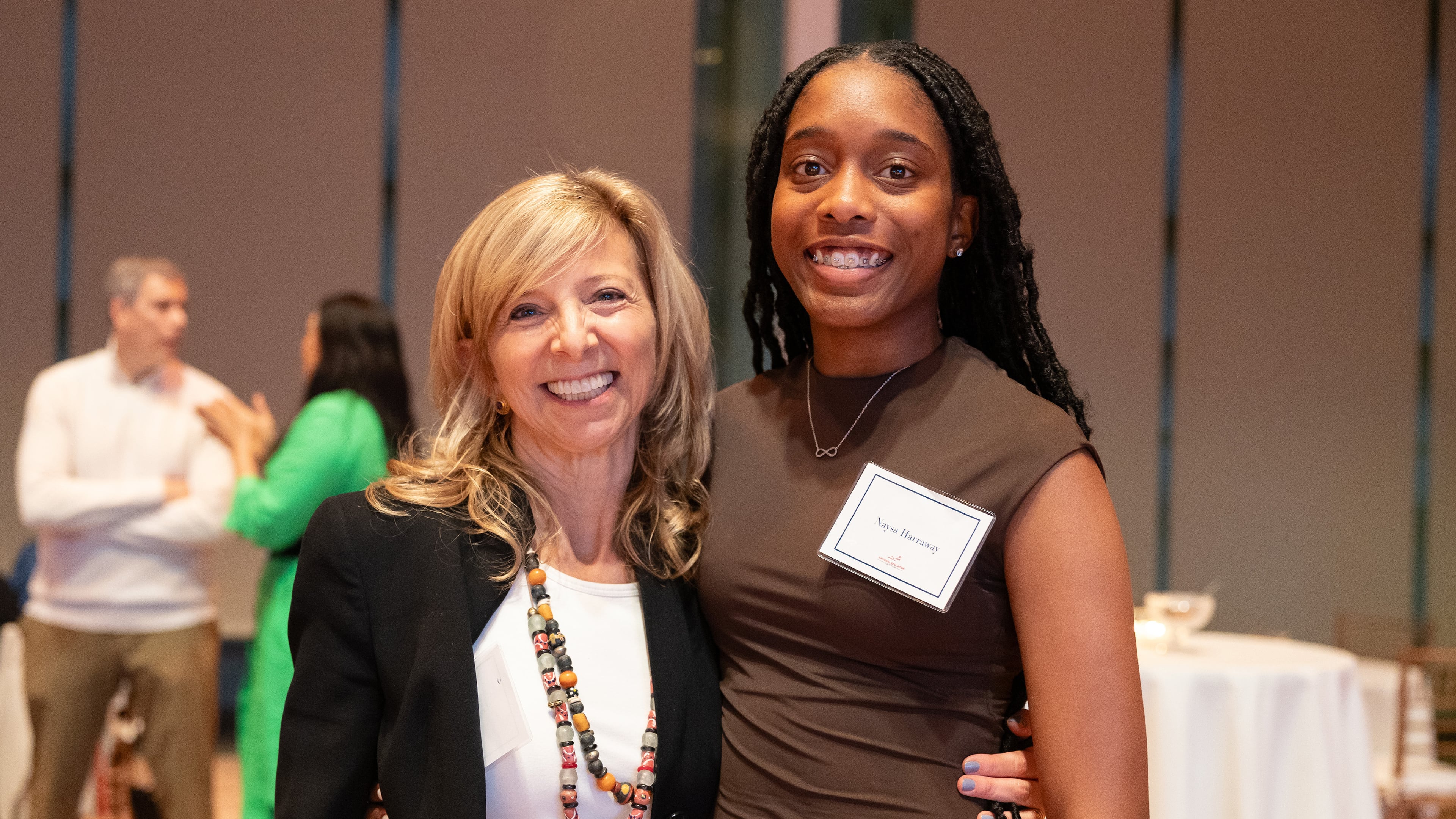 In this photo provided by National Education Equity Lab, Leslie Cornfeld, left, founder of the National Education Equity Lab, stands with Howard University alum Naysa Harraway at an Equity Lab event in New York, 2023. (National Education Equity Lab)