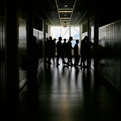 FILE - Students walk the halls at a high school in Philadelphia on Aug. 29, 2013. (AP Photo/Matt Slocum, File)