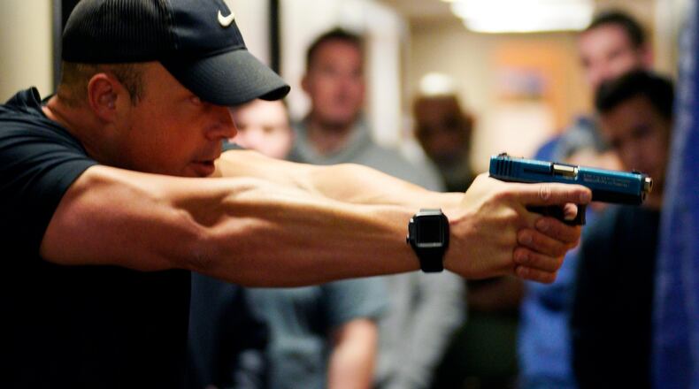 FILE PHOTO: Joe Deedon, former law enforecement officer and owner of Tac*One Consulting (L), teaches a "Lone Wolf" civilian active shooter response course for concealed weapons permit holders on March 24, 2018 in Longmont, Colorado. The class, based on a similar law enforcement course, is designed to challenge students mentally and physically leaving with a solid plan to defend themselves and others during the critical first moments of a deadly attack. (Photo by Rick T. Wilking/Getty Images)