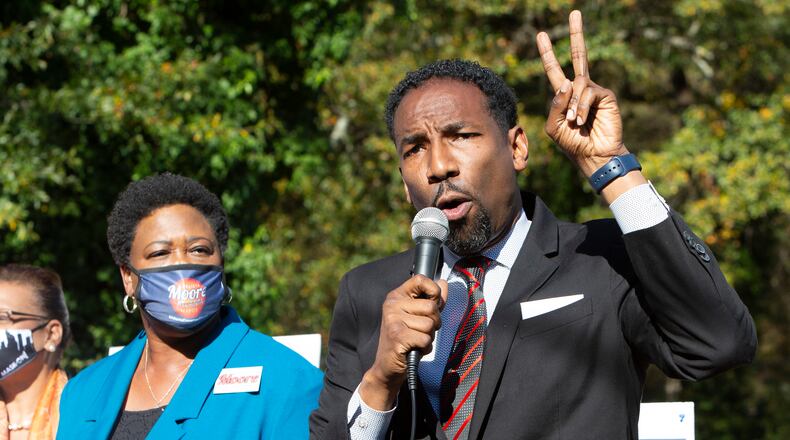 Felicia Moore listens as Andre Dickens speaks during an Anti-Election rally where Peoplestown residents are fighting the city of Atlanta's year long attempt to take away their homes. The city is trying to do so in order to improve the flood protection conditions in Peoplestown. The two mayoral runoff candidates say they support the people but one of them will ultimately be on the opposing side come January. PHIL SKINNER FOR THE ATANTA JOURNAL-CONSTITUTION