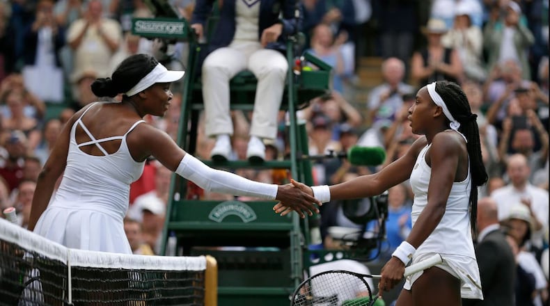 Venus Williams (left), Coco Gauff at the end of Monday's match at Wimbledon. (AP photo)