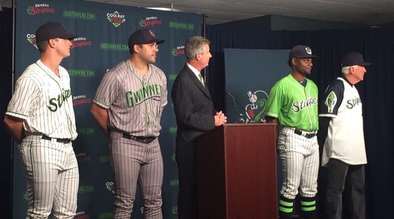 Gwinnett GM North Johnson speaks as Lucas Sims, Matt Tuiasosopo, Xavier Avery and hall of famer Phil Niekro model the new Stripers uniforms. (Gabriel Burns / AJC)