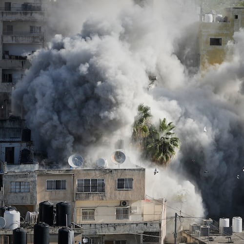 Smoke rises as Israeli forces demolish the home of Abdul Karim Sanoubar, a suspected Palestinian militant who has been accused by Israel of planting bombs on buses in central Israel, in Nablus, West Bank, Tuesday, Dec. 2, 2025. (AP Photo/Majdi Mohammed)