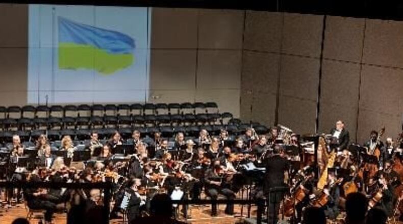 The Albany Symphony Orchestra performs the Ukrainian National Anthem with a projected photo of the nation's flag overhead. (Courtesy of Albany Symphony Orchestra)