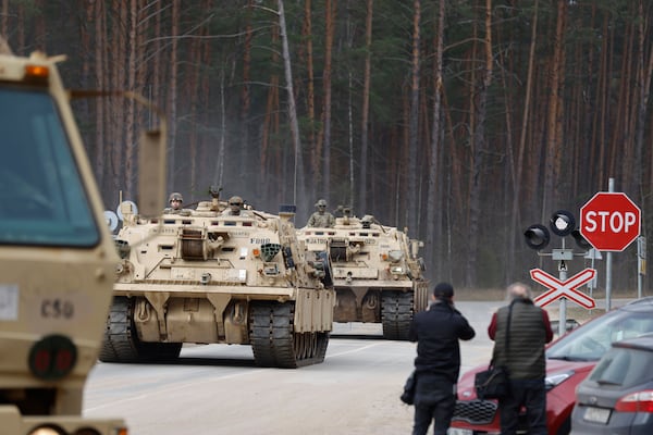 U.S. Army military vehicles including two M88 Recovery vehicles roll to attend recovery efforts continue for a missed U.S. Army soldier, as three other found dead on Monday, at a training range in Pabrade, north of Vilnius, Lithuania, Tuesday, April 1, 2025. (AP Photo/Mindaugas Kulbis)