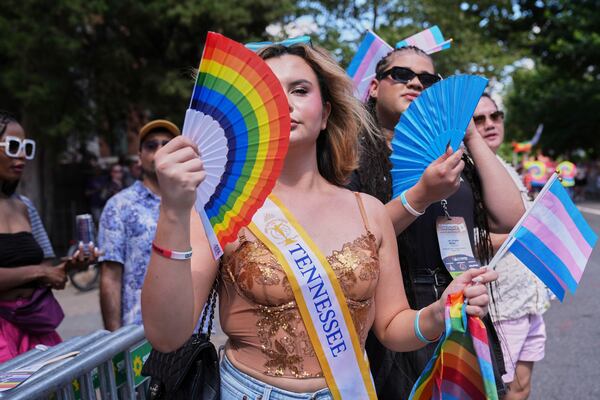 Bella Bautista, 22, a transgender woman, attends the World Pride Parade with Jae Douglas, 21, right, who identifies as a trans femme, Saturday, June 7, 2025, in Washington. A resident of Georgia, she’s wearing a sash from her time in the Miss Supranational USA pageant, in which she represented Tennessee. (AP Photo/Jacquelyn Martin)