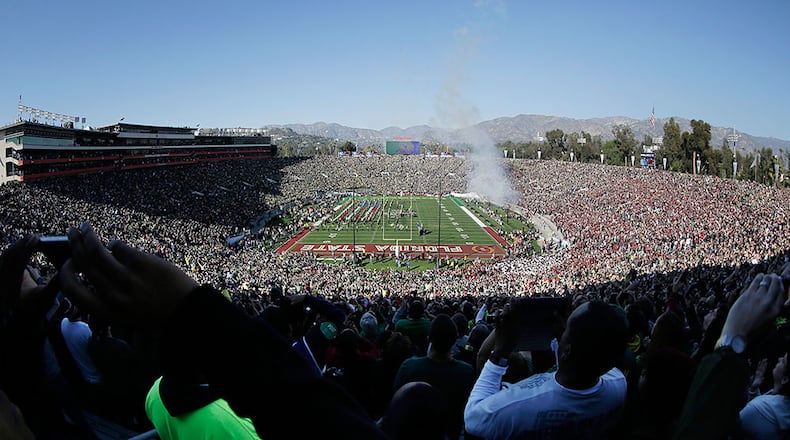 In this photo taken with a fisheye lens, a U.S. Air Force B-2 stealth bomber does a flyover before the Rose Bowl NCAA college football playoff semifinal between Oregon and Florida State, Thursday, Jan. 1, 2015, in Pasadena, Calif. (AP Photo/Richard Vogel)