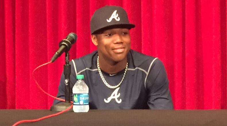 Ronald Acuna meets with the media before his major league debut on April 25 at Great American Ball Park in Cincinnati. (Gabe Burns / AJC)