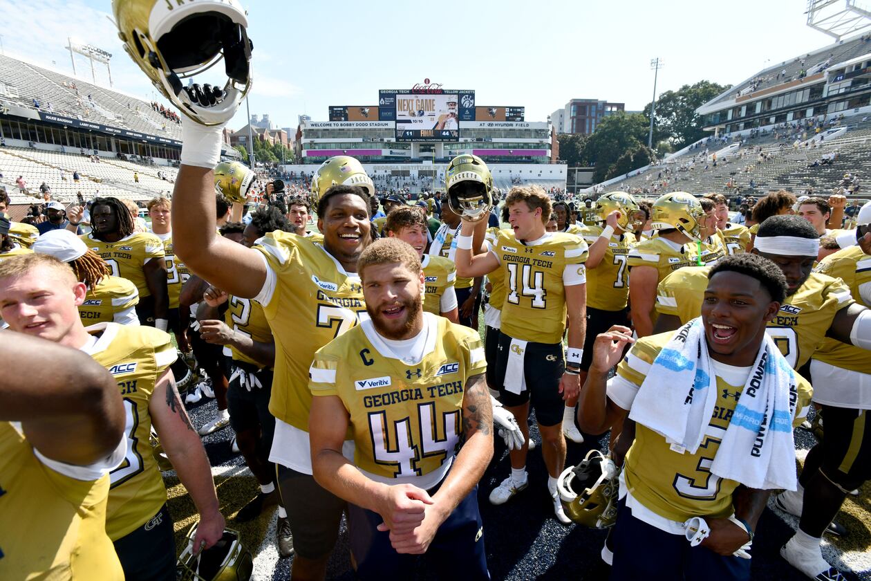 Georgia Tech players celebrate after Georgia Tech defeated Mercer during the second half of an NCAA college football game at Bobby Dodd Stadium on Saturday, Sept. 19, 2026, in Atlanta. Georgia Tech defeated Mercer 44-11. (Hyosub Shin/AJC)