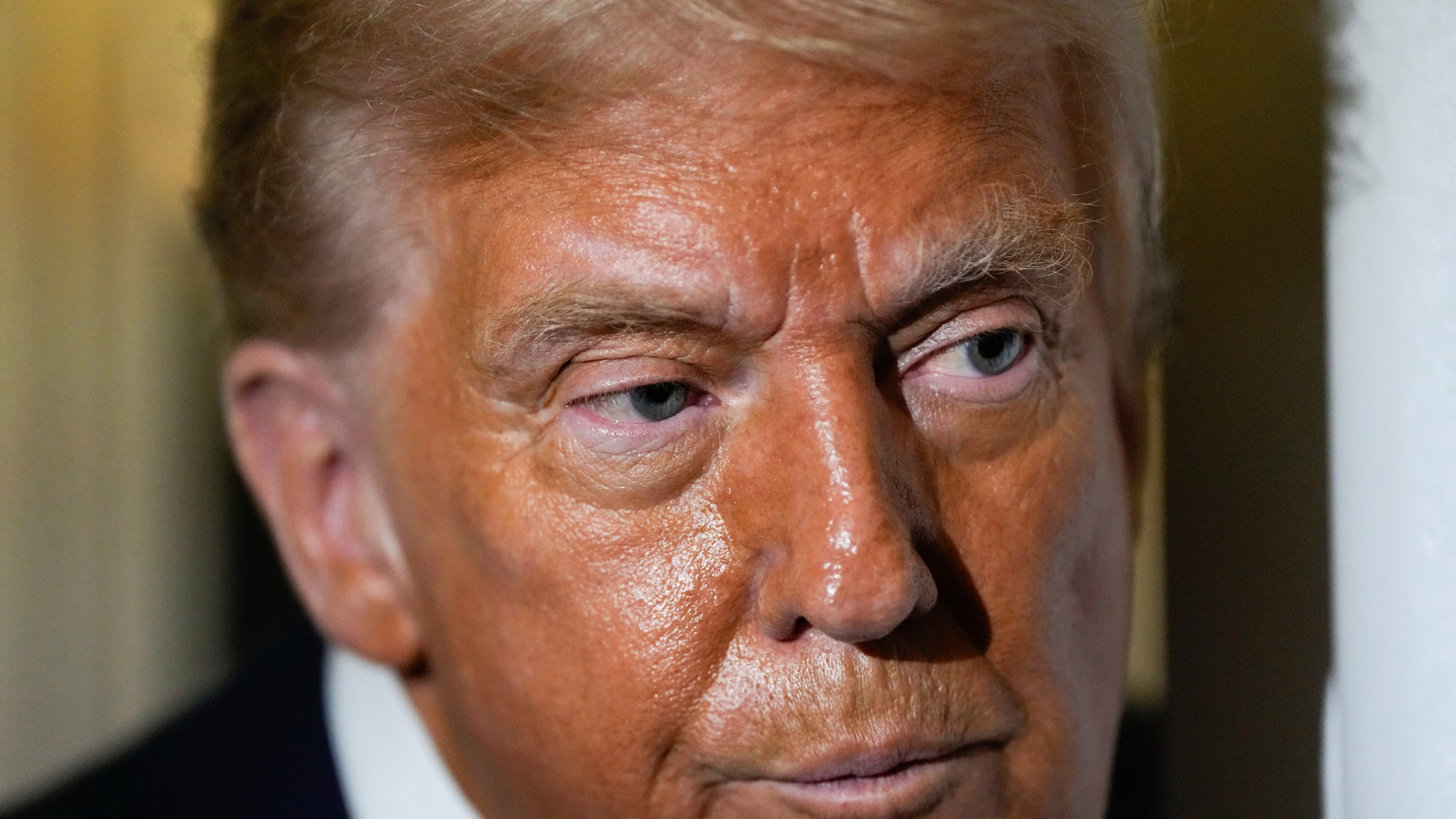 President Donald Trump speaks to reporters aboard Air Force One while en route to Joint Base Andrews, Md. after attending a memorial for conservative activist Charlie Kirk in Glendale, Ariz., Sunday, Sept. 21, 2025. (AP Photo/Julia Demaree Nikhinson)