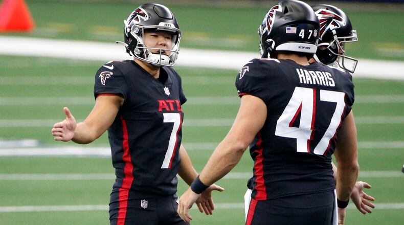 Falcons kicker Younghoe Koo (7) and long snapper Josh Harris (47) celebrate a successful field goal attempt in the first half against the Dallas Cowboys Sunday, Sept. 20, 2020, in Arlington, Texas. (Ron Jenkins/AP)