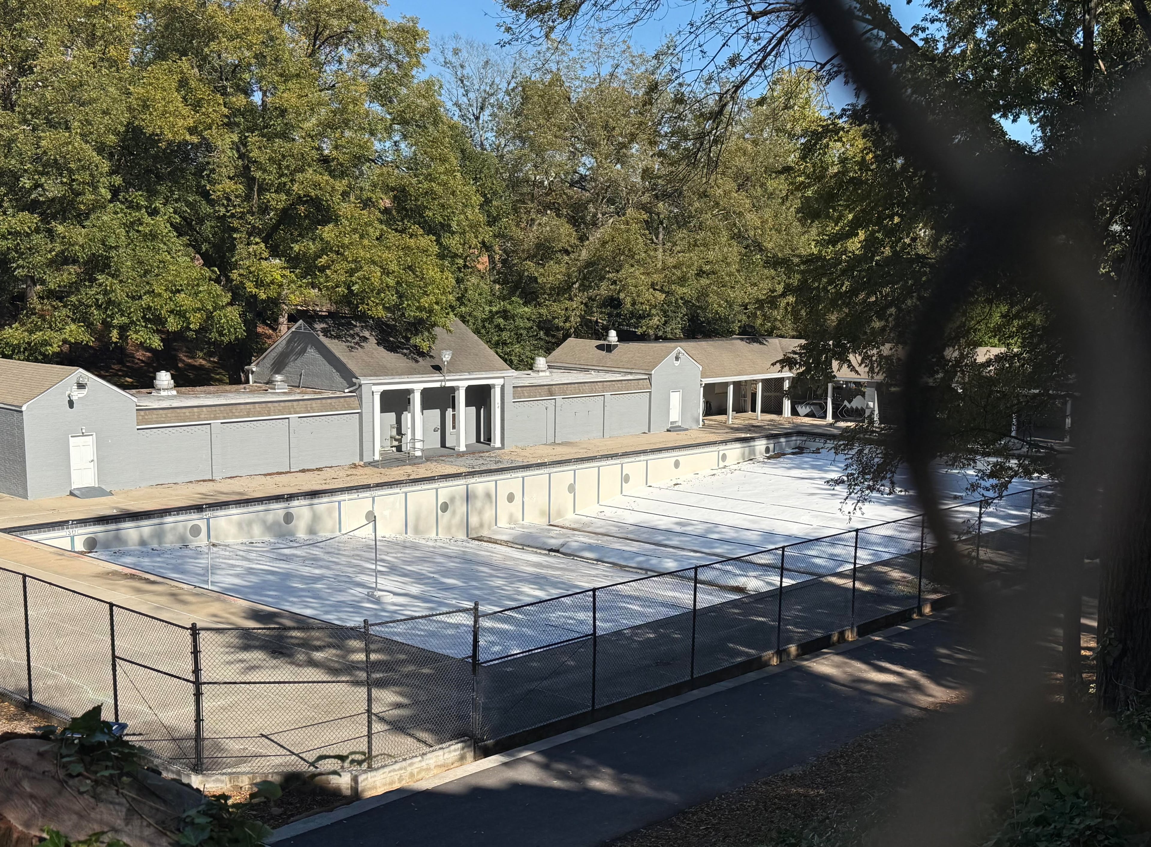 Legion Pool sits empty after being drained of its water on the University of Georgia campus on Friday, Oct. 31, 2025, in Athens. To some, the pool is outdated and underused. To others, it’s a living piece of Classic City history. (Fletcher Page/AJC)