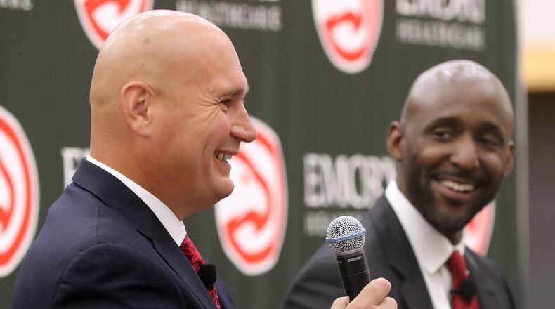 May 14, 2018 Atlanta: The Atlanta Hawks general manager Travis Schlenk introduces Lloyd Pierce as the 13th full-time coach in the Atlanta history of the NBA basketball franchise on Monday, May 14, 2018, in Atlanta. Pierce joins the Hawks after spending the past five seasons as an assistant coach with the 76ers. He also spent time with the Cavaliers, Warriors and Grizzlies organizations.   Curtis Compton/ccompton@ajc.com