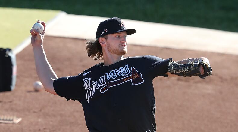 Rehabbing from a torn right Achilles tendon, Atlanta Braves righthander Mike Soroka throws from the practice mounds getting in a morning workout at spring training Thursday, Feb. 25, 2021, at CoolToday Park in North Port, Fla. (Curtis Compton / Curtis.Compton@ajc.com)