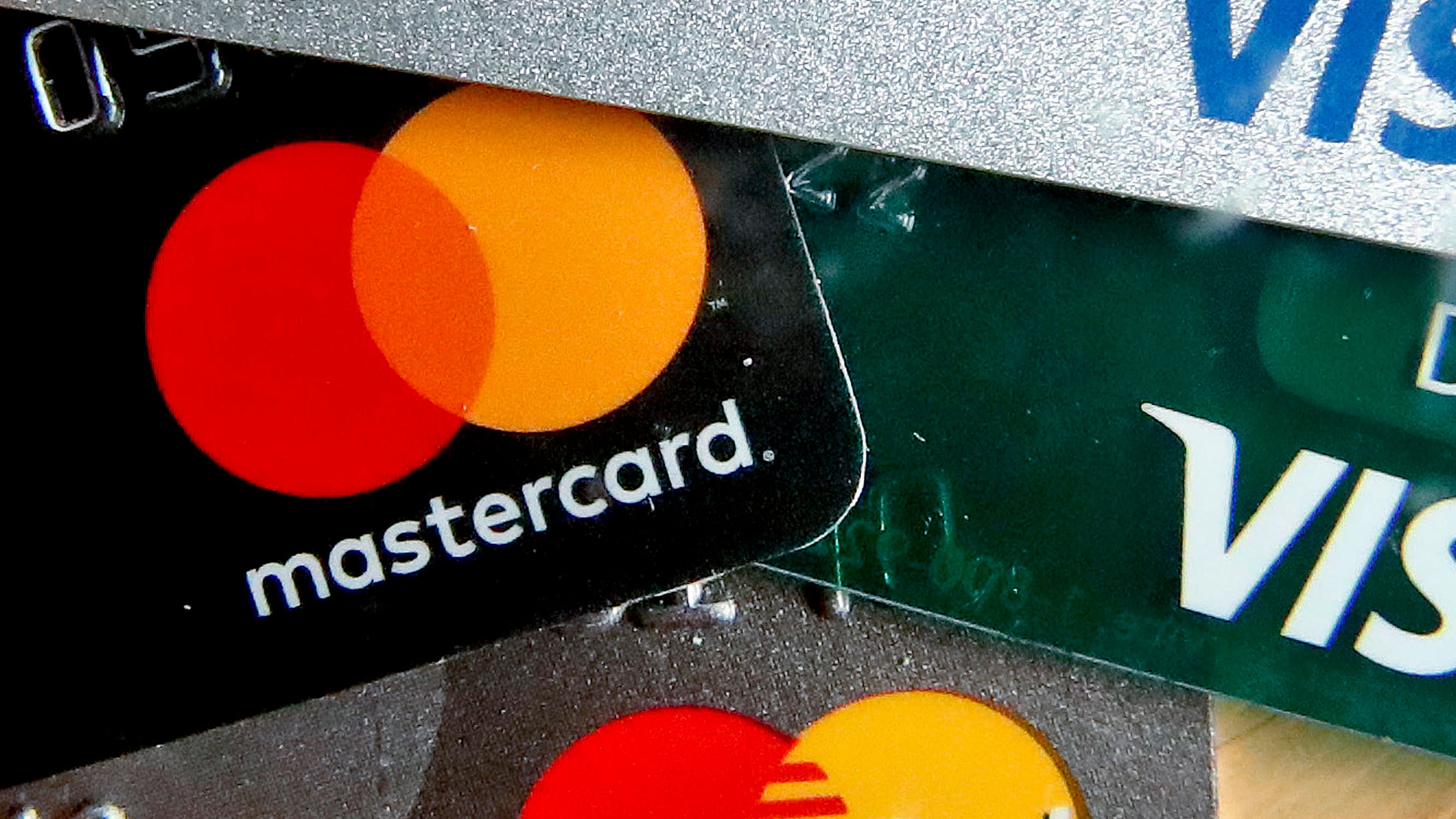 FILE - In this Feb. 20, 2019, file photo are Mastercard and Visa credit cards in Zelienople, Pa. (AP Photo/Keith Srakocic, File)